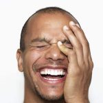 Man laughing - antidote to stress